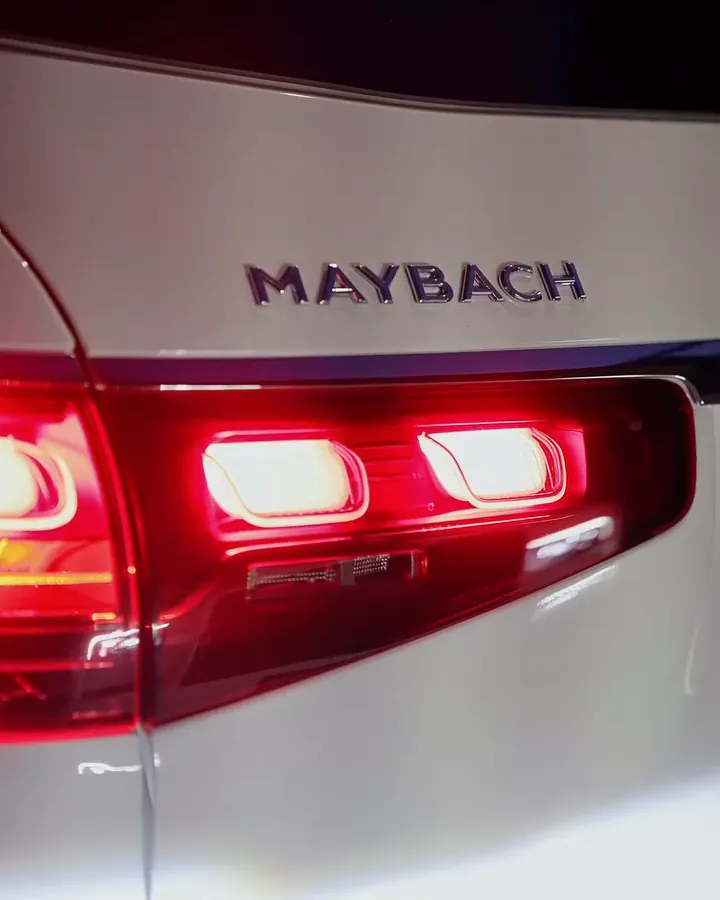 The Maybach badge and tail lights of a white Maybach GLS
