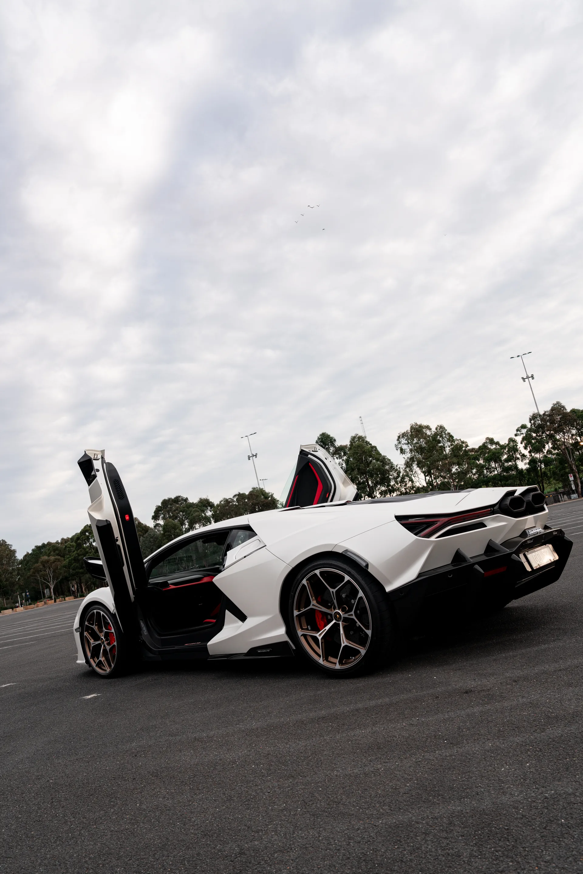 White Lamborghini Revuelto in the showroom