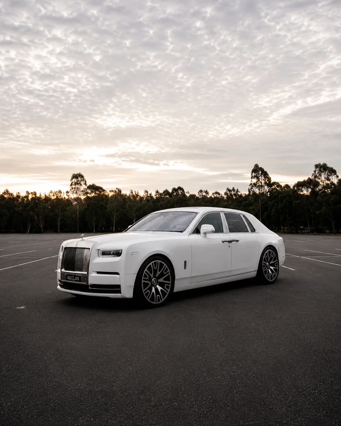 White Rolls-Royce Phantom at sunset — G Class Hire Sydney