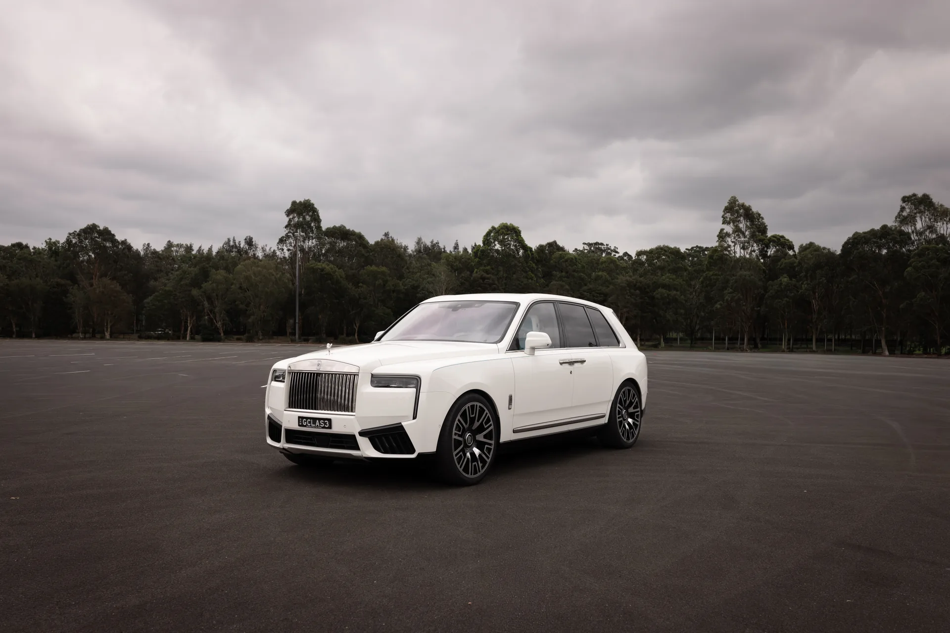 A white Rolls-Royce Cullinan — chauffeured hire in Sydney