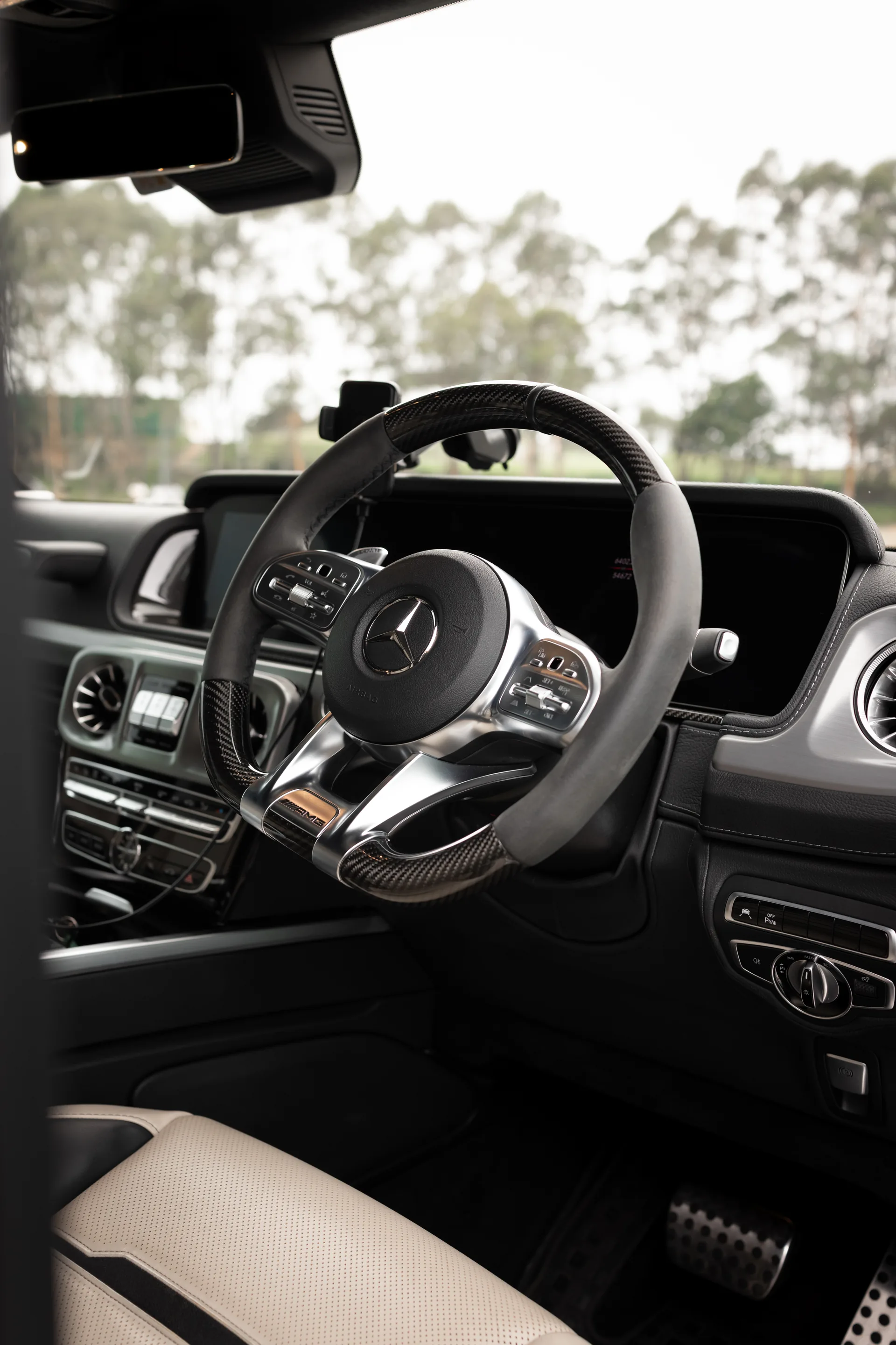 A white Mercedes-AMG G63 G-Wagon — chauffeured hire in Sydney
