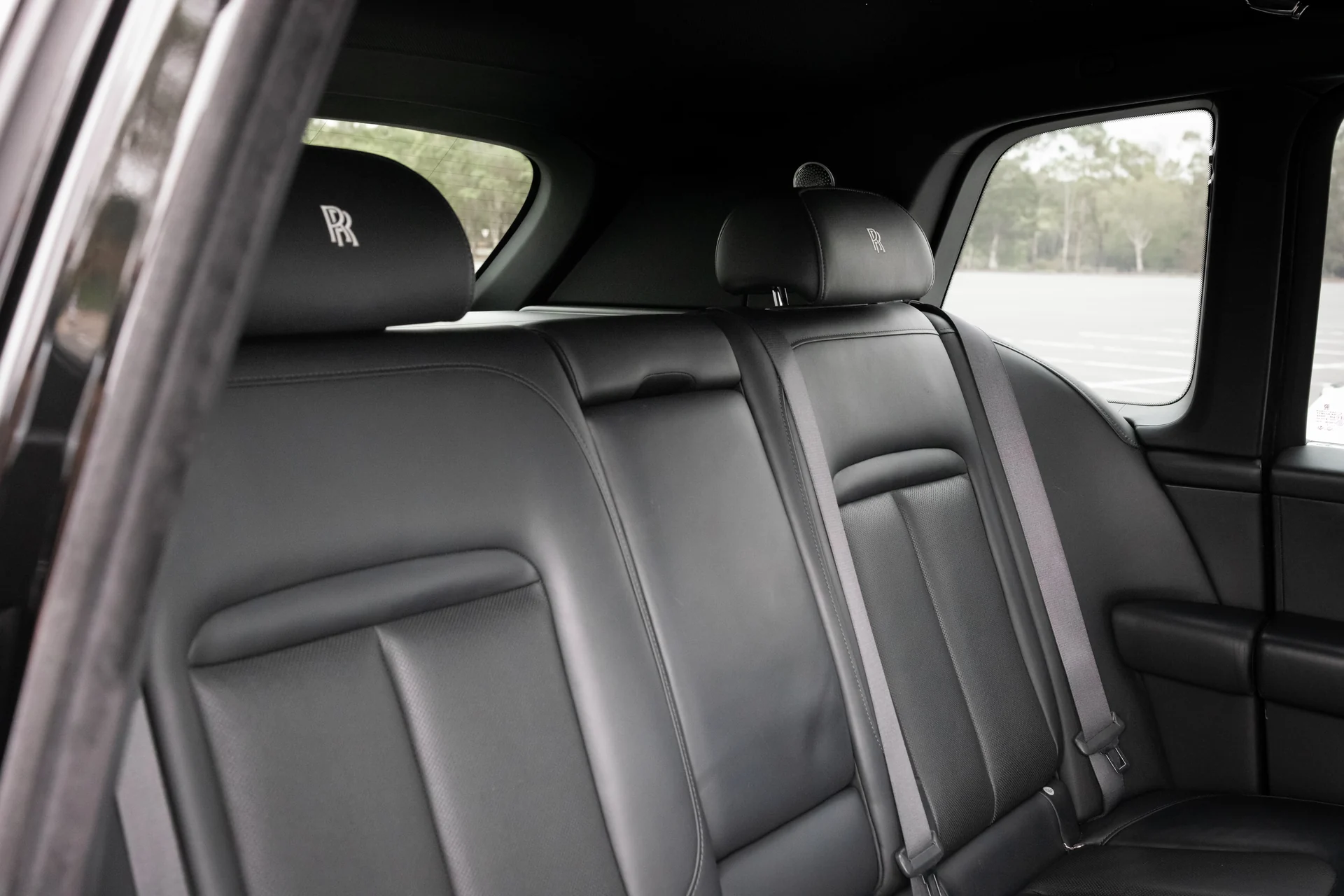 Black leather rear seats of a Rolls-Royce Cullinan Series I