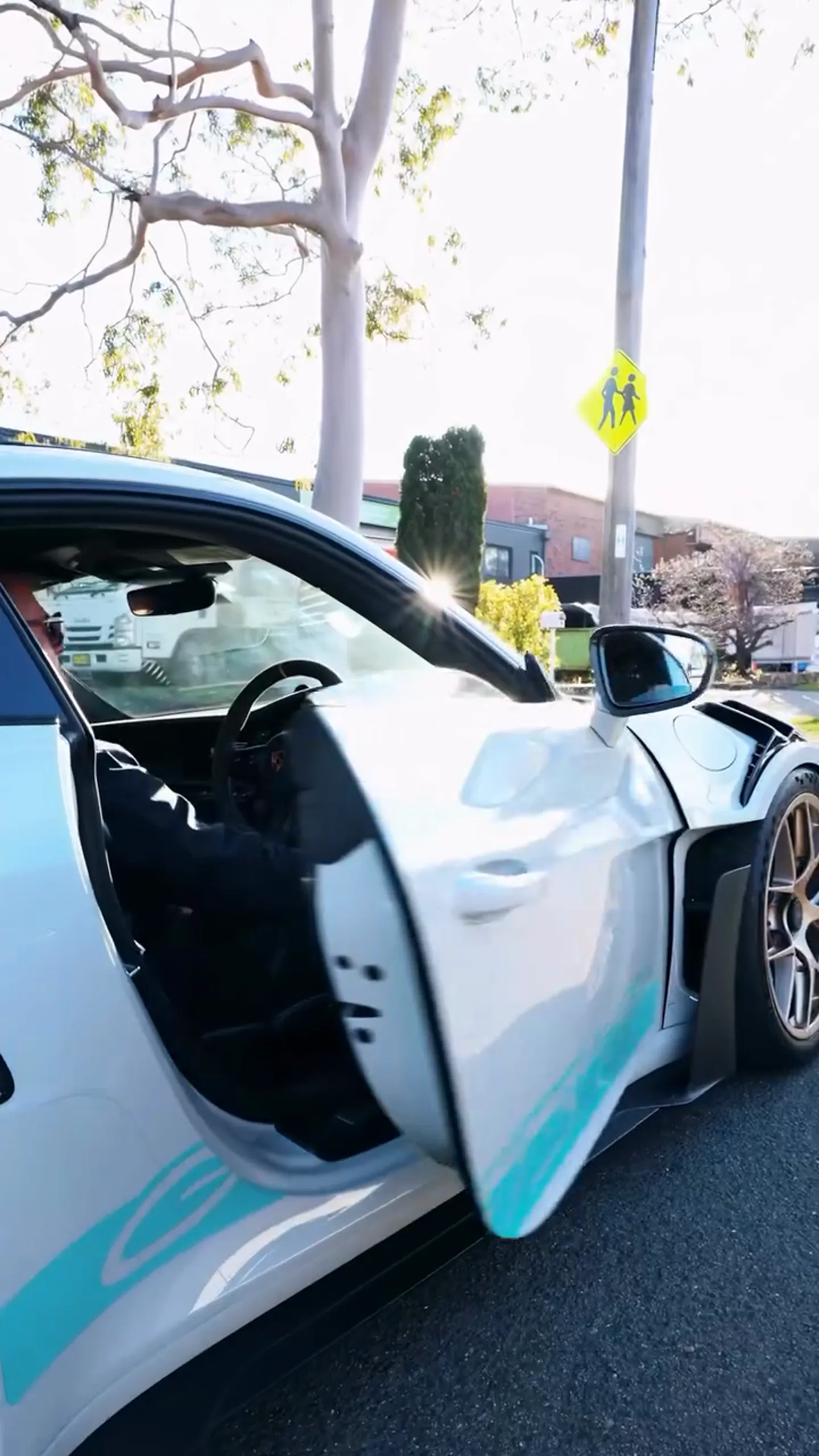 A client stepping into the replacement Porsche 911 GT3 RS at the kerb